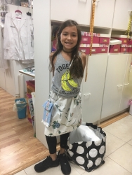 Arianna made a skirt, the purse and a jacket for her friend's cat